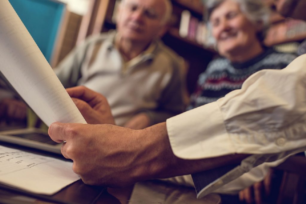 Close up of financial advisor having a meeting with seniors.