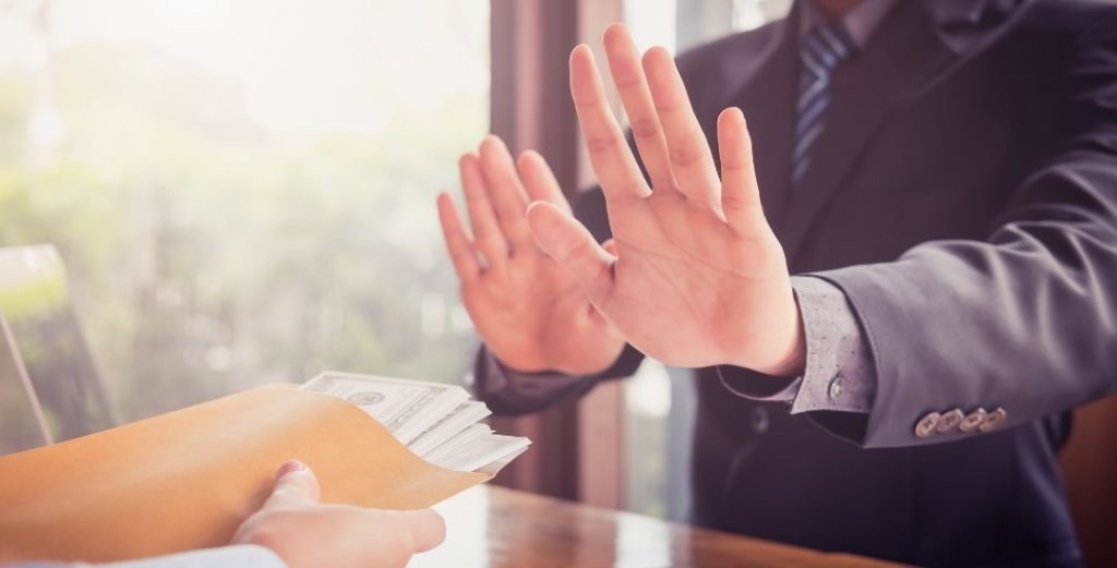 Person in suit denying cash