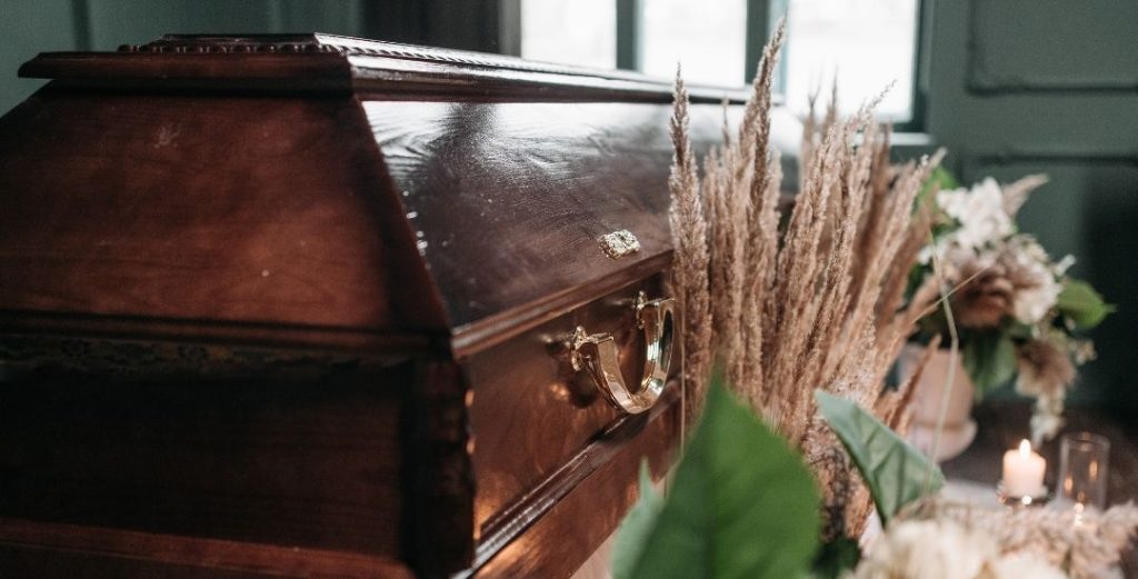 Funeral casket with neutral flowers