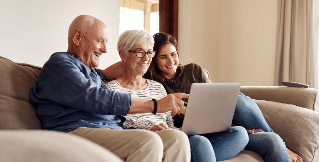 Elderly Couple with Adult Daughter Discussing Long-Term Care