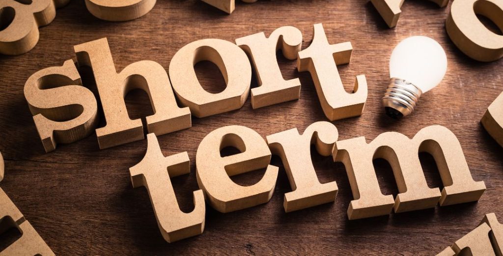 Short Term Spelled in Wooden Letters